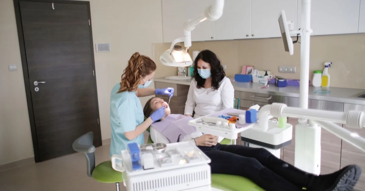 Dentist and patient during a professional dental cleaning