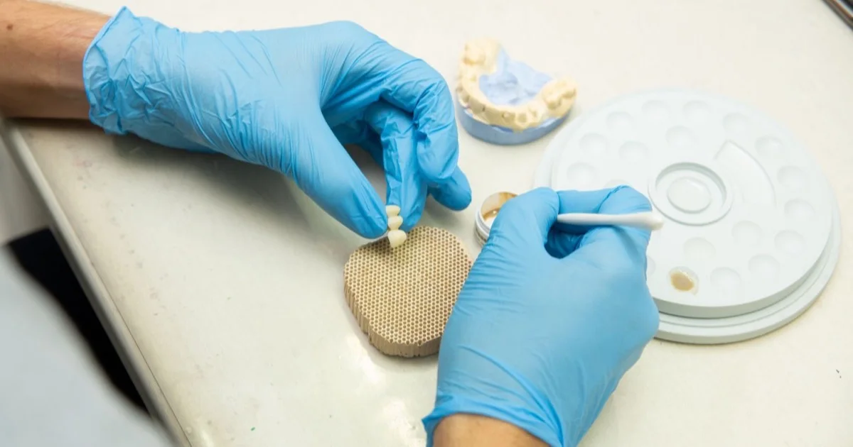 Dental technician making a ceramic crown