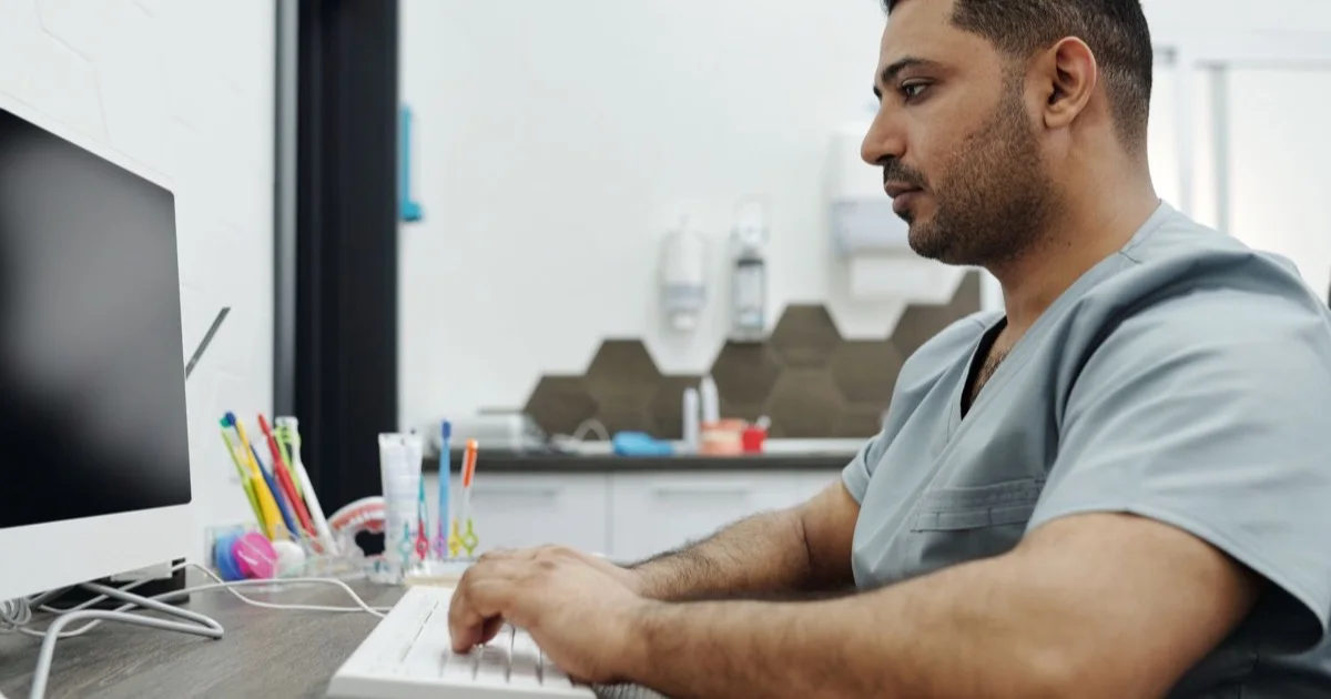 Dentist working on a smile design on a computer