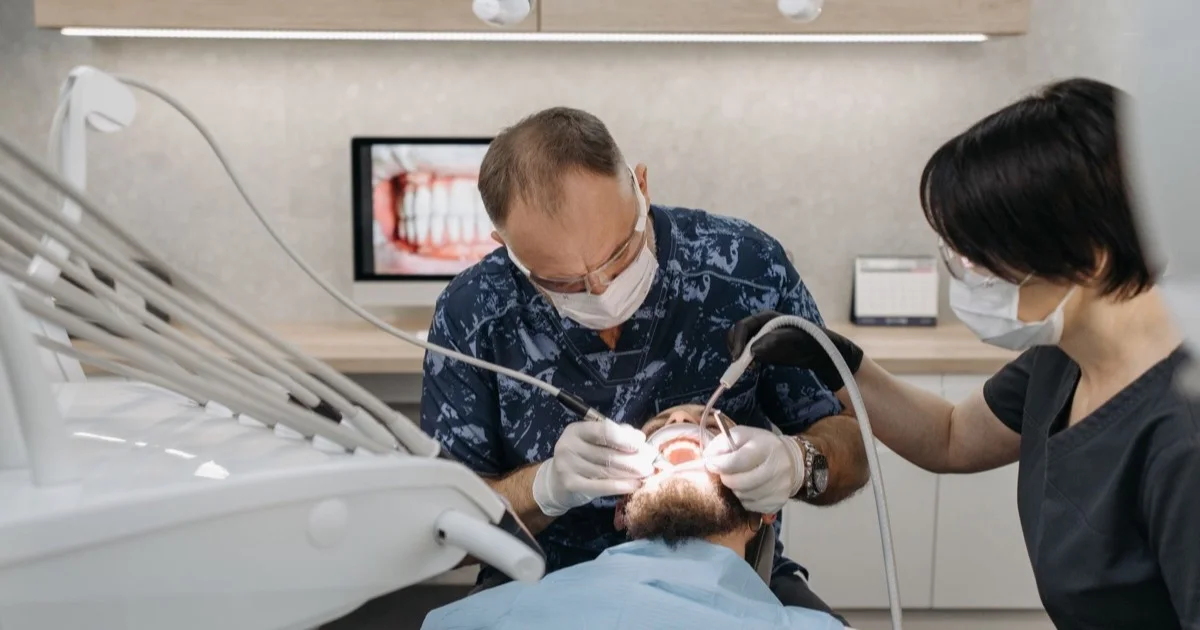 Dentist and assistant carrying out a procedure