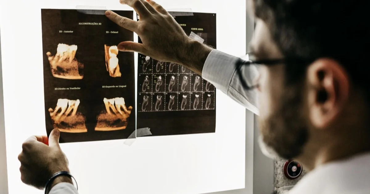 Dentist analysing an X-ray image