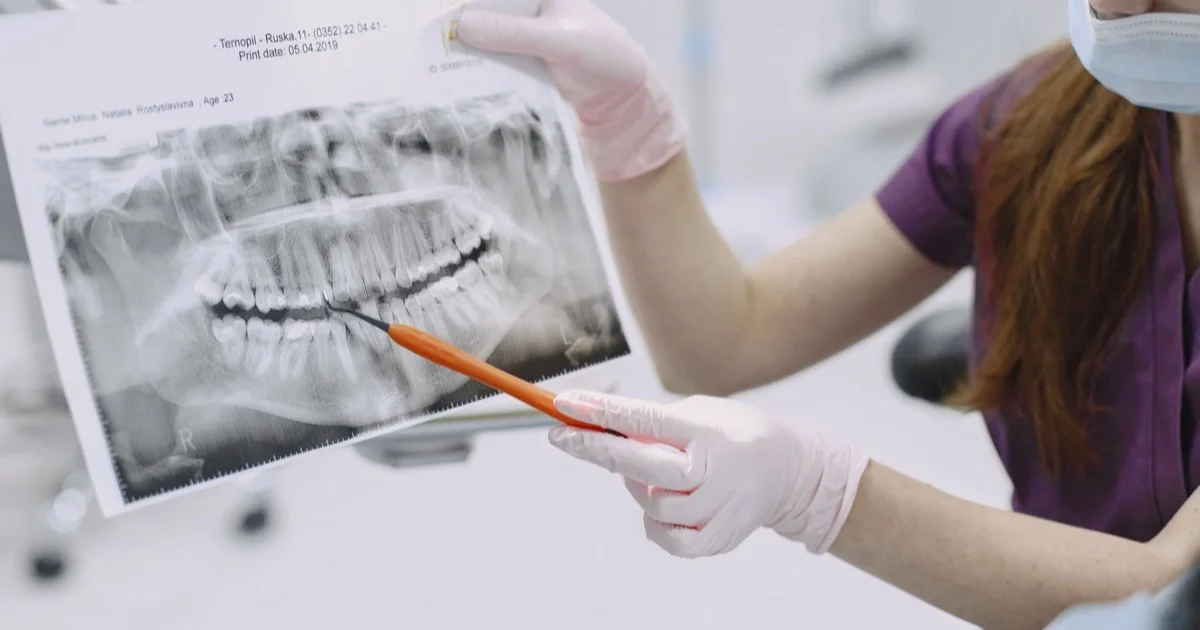 Dentist explaining examination results to a patient